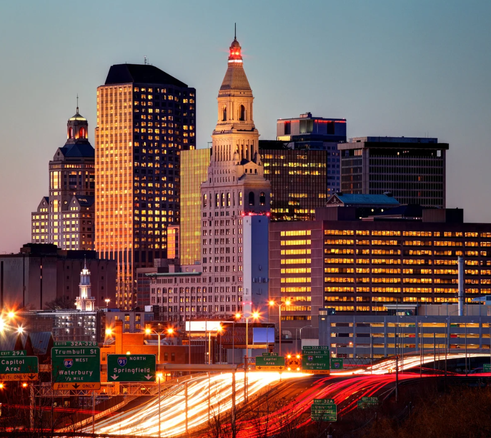 Hartford, Connecticut skyline at dusk with highway light trails